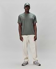 Mens Oscar Oversized Tee in dark sage green, featuring a smooth jersey knit fabric and a small, embroidered light grey Psycho Bunny skull logo on the left chest for a refined streetwear look. (3)