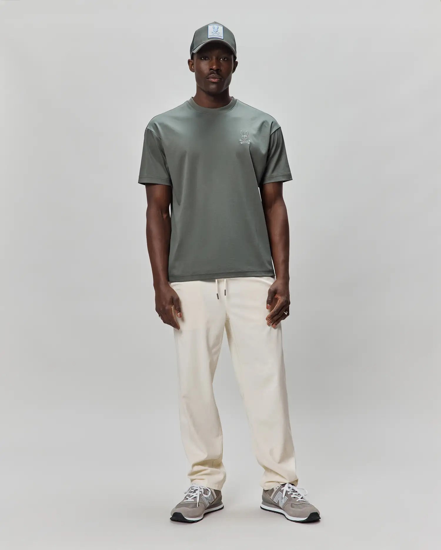 Mens Oscar Oversized Tee in dark sage green, featuring a smooth jersey knit fabric and a small, embroidered light grey Psycho Bunny skull logo on the left chest for a refined streetwear look. (3)