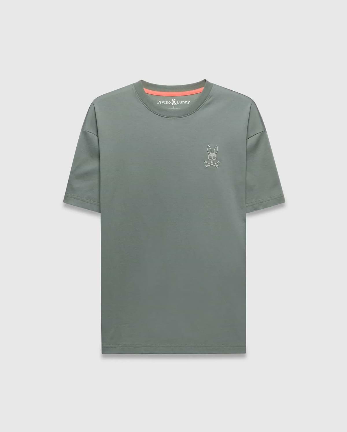 Mens Oscar Oversized Tee in muted sage green jersey knit, featuring a small white embroidered Psycho Bunny skull logo on the left chest and a vibrant coral inner collar accent. (4)