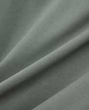 MENS OSCAR OVERSIZED TEE, a premium oversized tee in a rich sage green, featuring a finely textured, soft jersey knit fabric with elegant drapes and subtle sheen. (5)