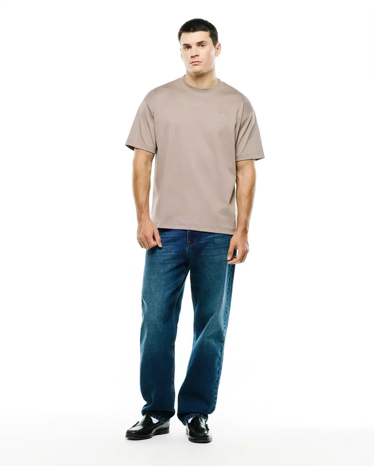 Men's Oscar Oversized Tee in taupe, crafted from smooth jersey fabric with an oversized fit, featuring a small, tonal embroidered Psycho Bunny skull logo on the left chest. (4)