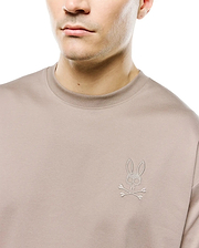 Men's Oscar Oversized Tee in taupe smooth jersey, featuring a small, tonal embroidered Psycho Bunny skull logo on the left chest. (2)