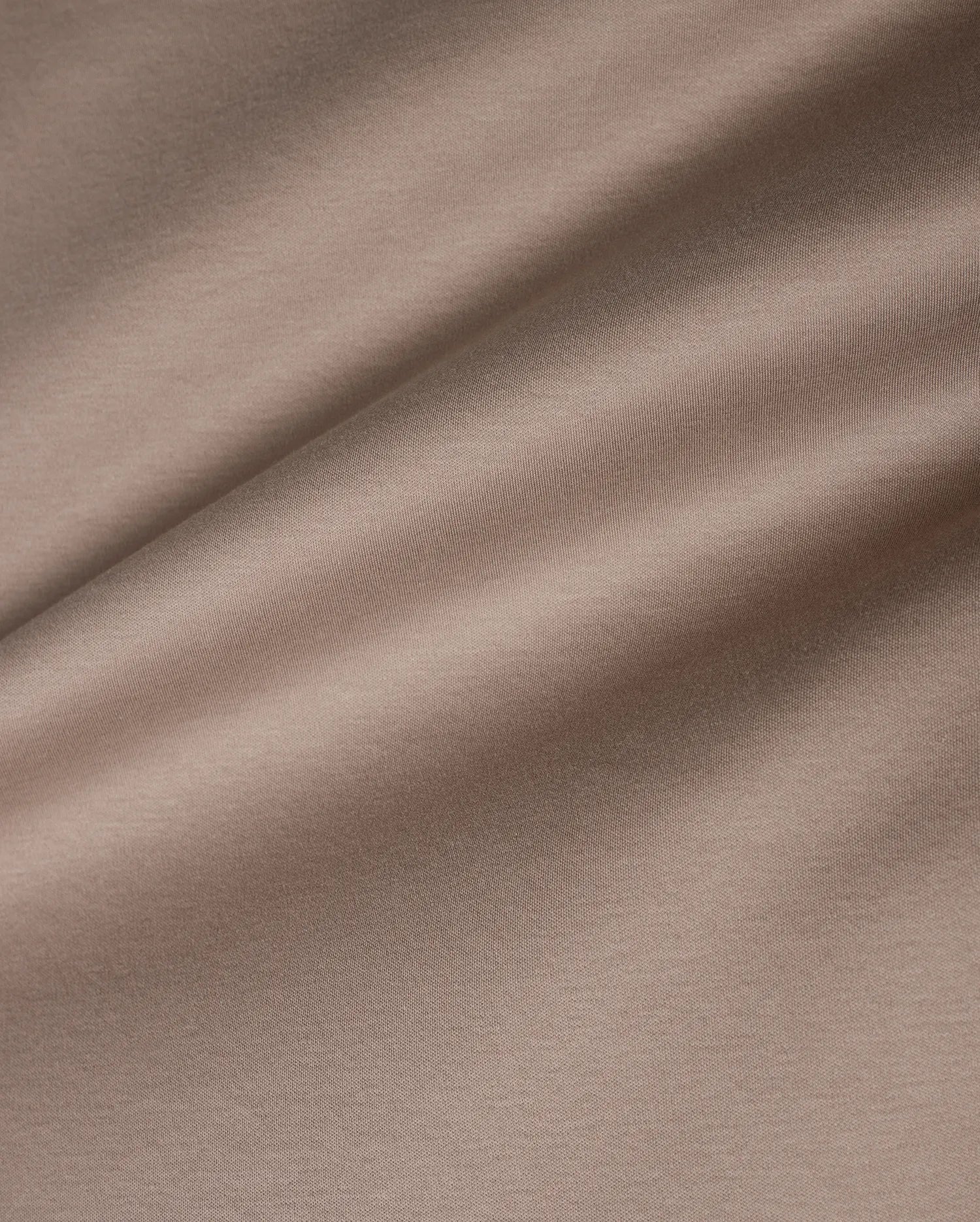 Men's Oscar Oversized Tee in premium, soft taupe jersey knit fabric, featuring a smooth texture with subtle horizontal ribbing and a relaxed drape, ideal for refined streetwear. (6)
