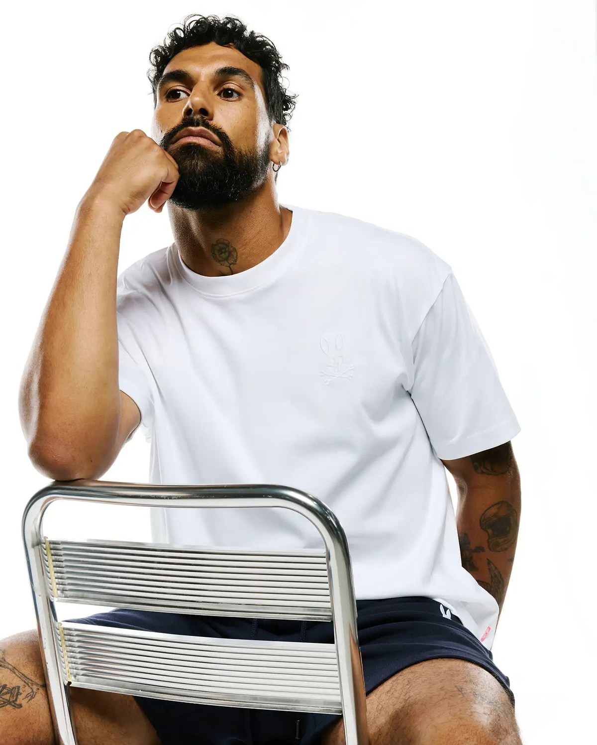 White MENS OSCAR RELAXED FIT TEE in smooth jersey knit, featuring a small, tone-on-tone embroidered Psycho Bunny skull logo on the left chest.