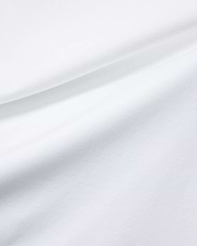 Mens Oscar Relaxed Fit Tee in premium, soft white jersey fabric, featuring subtle fabric folds and the signature small embroidered Psycho Bunny skull logo on the chest.