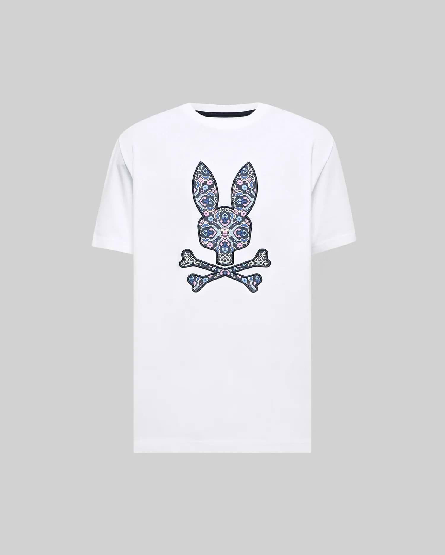 Mens Luke Graphic Tee, a white classic fit jersey t-shirt featuring a large central Psycho Bunny skull logo graphic with intricate blue, pink, and purple floral patterns.