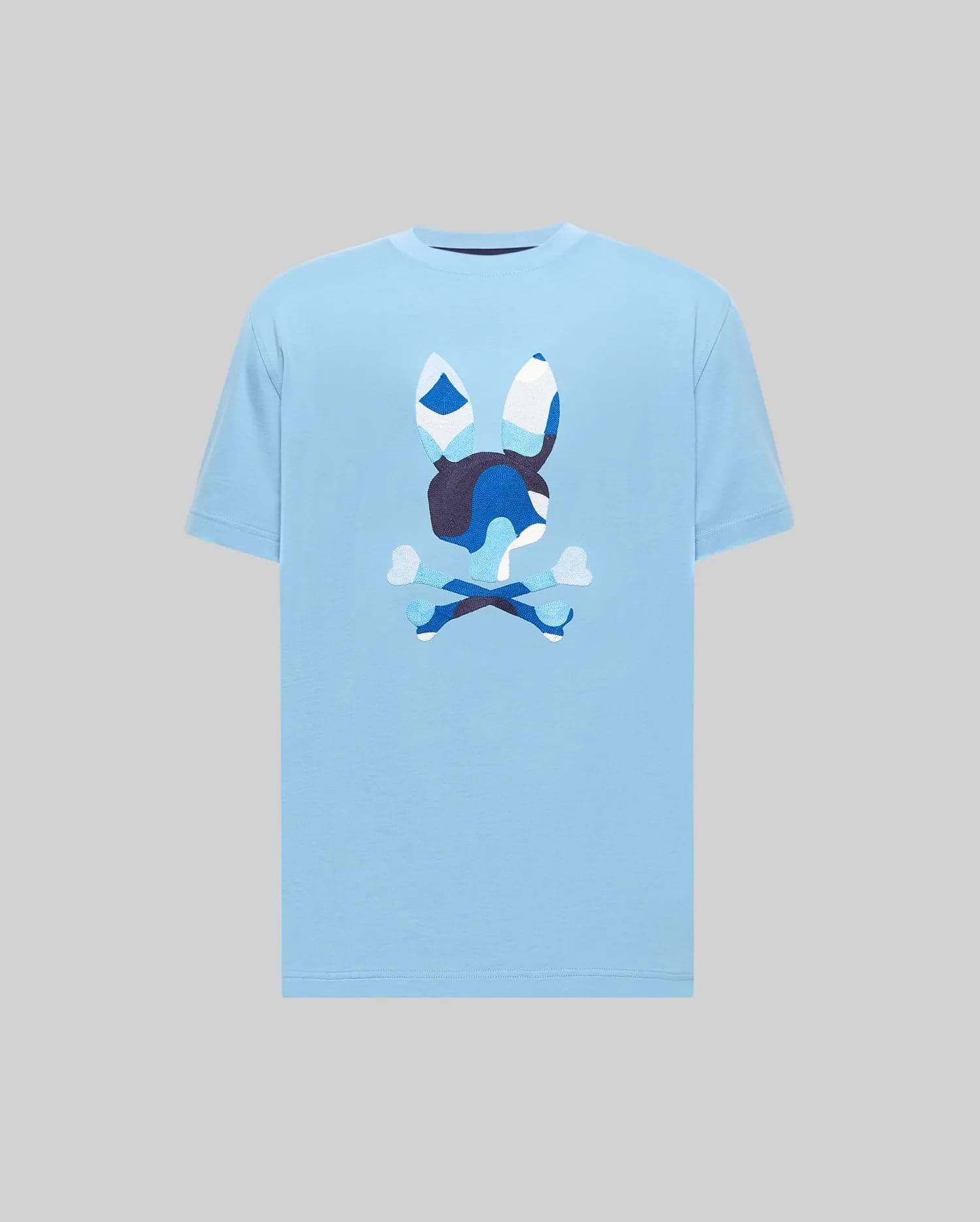 Mens Ara Graphic Tee in light blue, featuring a large central blue camouflage Psycho Bunny skull graphic on soft jersey knit with a classic fit.