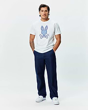 Mens Brad Graphic Tee, white classic fit jersey t-shirt featuring a large, intricately blue patterned Psycho Bunny skull logo centered on the chest.
