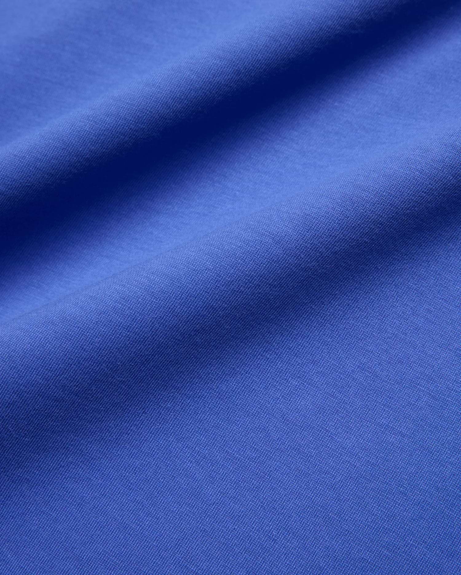 Mens Sunny Chest Graphic Tee in vibrant royal blue, featuring a smooth jersey knit fabric and an implied chest graphic with the iconic Psycho Bunny skull logo.