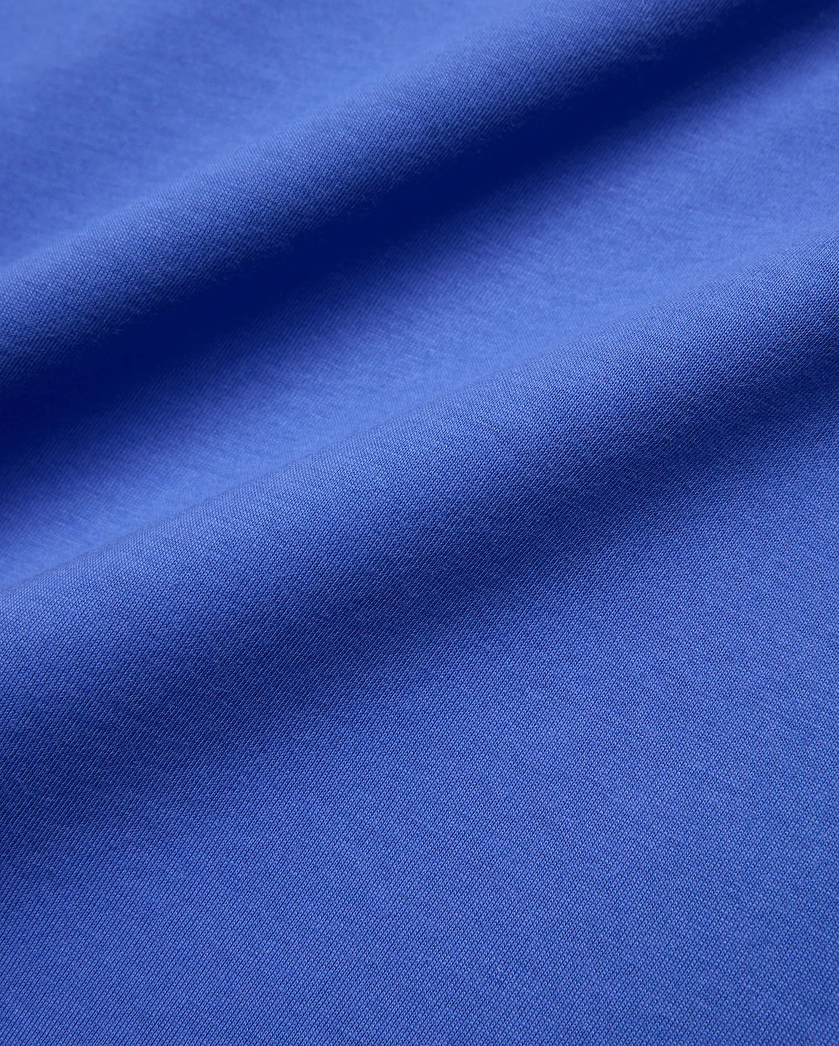 Mens Sunny Chest Graphic Tee in vibrant royal blue, featuring a smooth jersey knit fabric and an implied chest graphic with the iconic Psycho Bunny skull logo.