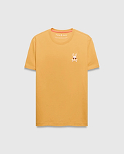 Mens Sunny Chest Graphic Tee. Golden yellow classic fit jersey t-shirt with a small embroidered Psycho Bunny skull logo wearing sunglasses on the left chest, featuring orange neck tape.