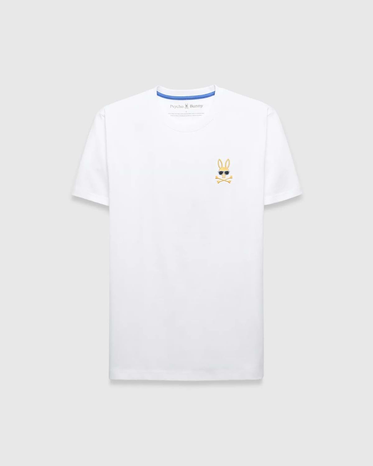 Mens Sunny Chest Graphic Tee, a classic fit white jersey t-shirt featuring a small embroidered gold Psycho Bunny skull logo with black sunglasses and white crossbones on the left chest, with blue inner collar trim.
