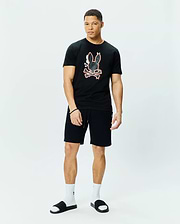 Black Mens Tanner Bunny Graphic Tee, classic fit jersey knit, with a large central orange-outlined bunny skull and crossbones graphic. Black relaxed fit knit shorts with drawstring and small embroidered bunny logo.