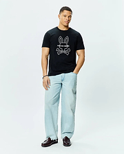 Mens Craig Graphic Tee, a classic fit black cotton jersey t-shirt featuring a large white outline Psycho Bunny skull and crossbones graphic logo centered on the chest.