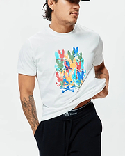 Mens Tanner Graphic Tee, a classic fit white jersey t-shirt featuring a large, vibrant multi-color graphic print of stacked Psycho Bunny skull logos and crossbones on the chest.