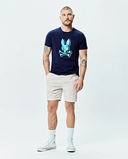Mens Ethan Graphic Tee in navy blue, featuring a classic fit and soft jersey fabric. A large, central chest graphic displays the iconic Psycho Bunny skull logo in faceted light and dark blue with white outlines. (6)