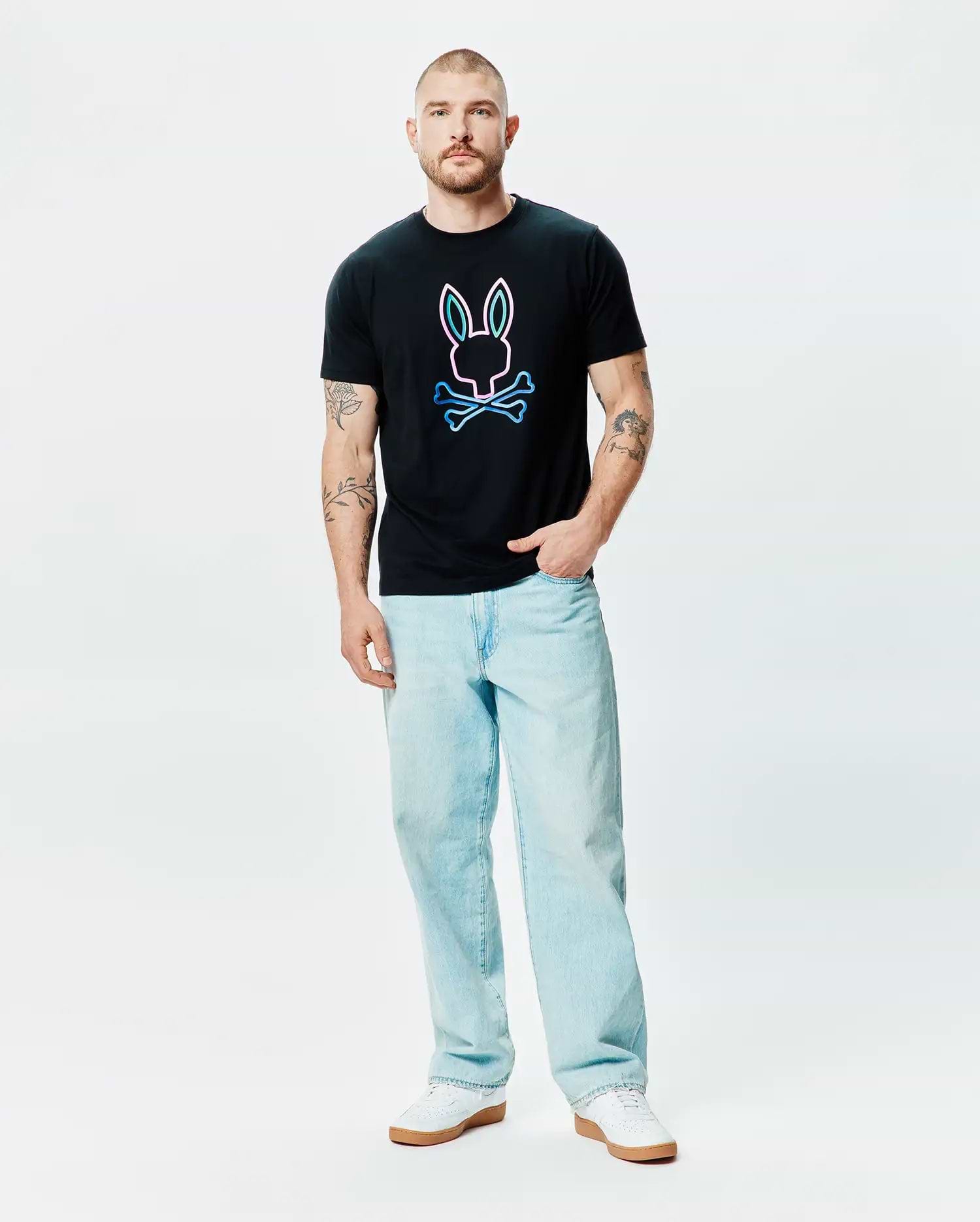 Mens Dayton Graphic Tee, a black classic fit jersey t-shirt featuring a large center chest graphic of the iconic Psycho Bunny skull and crossbones logo with a vibrant neon pink and blue outline. (4)