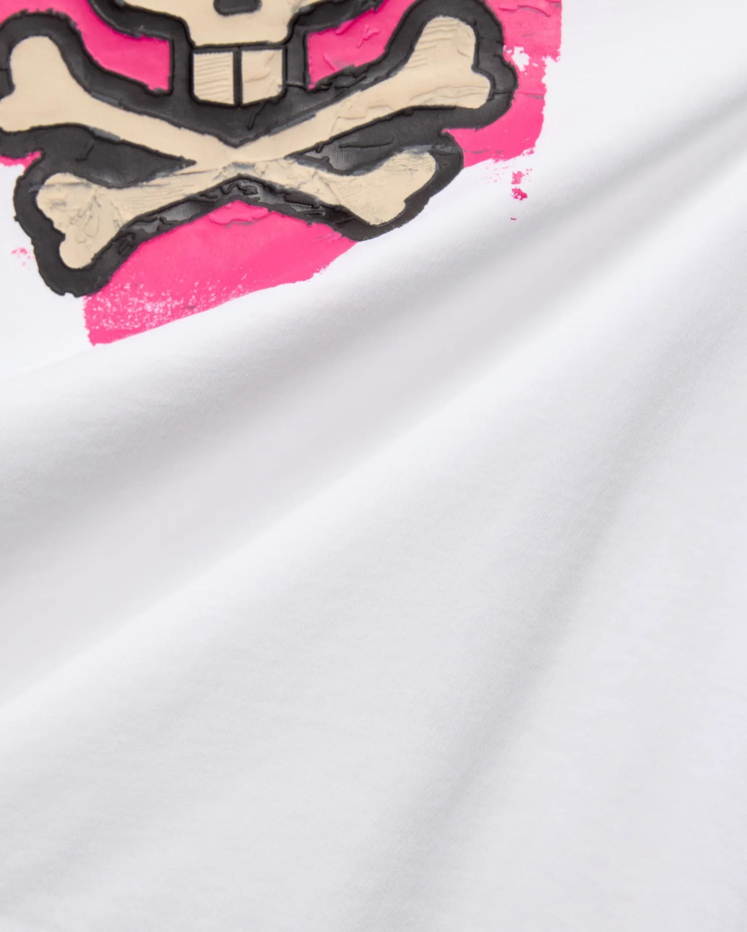 Mens Marcus Bunny Graphic Tee in white jersey, showcasing a large, textured black and beige Psycho Bunny skull logo with bold hot pink brushstroke accents on the chest.