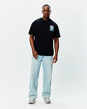 Black Mens Isaac Relaxed Fit Tee, a soft jersey t-shirt featuring a small, square, vibrant multi-color Psycho Bunny skull graphic on the left chest.