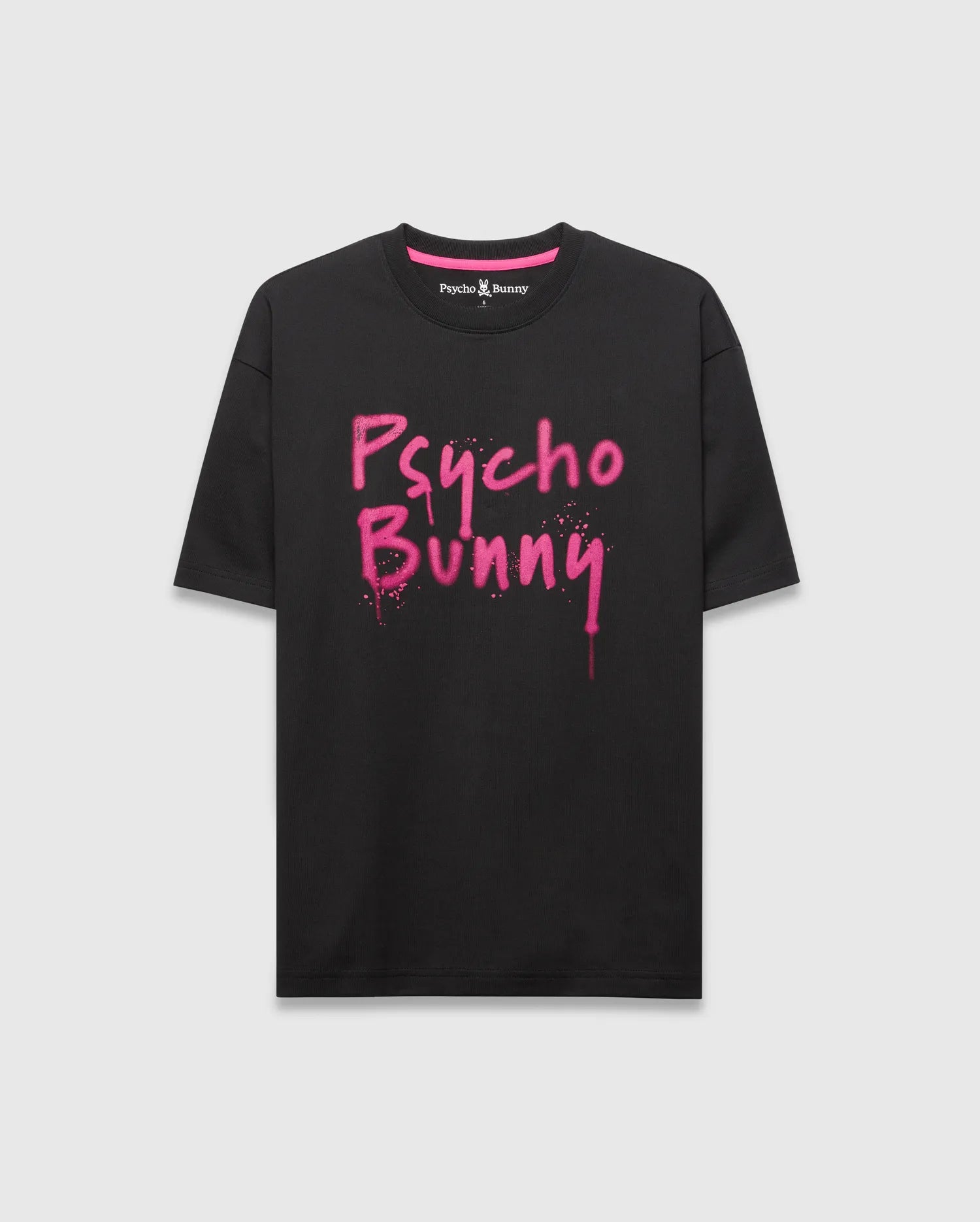 Mens Duncan Wordmark Relaxed Fit Tee, a black jersey t-shirt with a relaxed fit, featuring a bold pink spray paint Psycho Bunny wordmark graphic, small embroidered bunny skull logo, and pink inner neck tape.