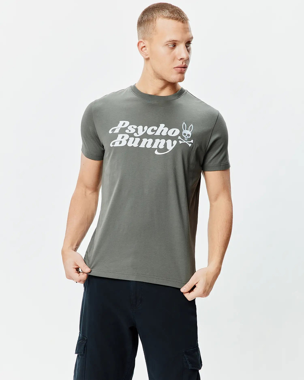 Dark grey classic fit jersey Mens Byron Wordmark Tee with a prominent white Psycho Bunny wordmark and iconic bunny skull logo graphic on the chest.