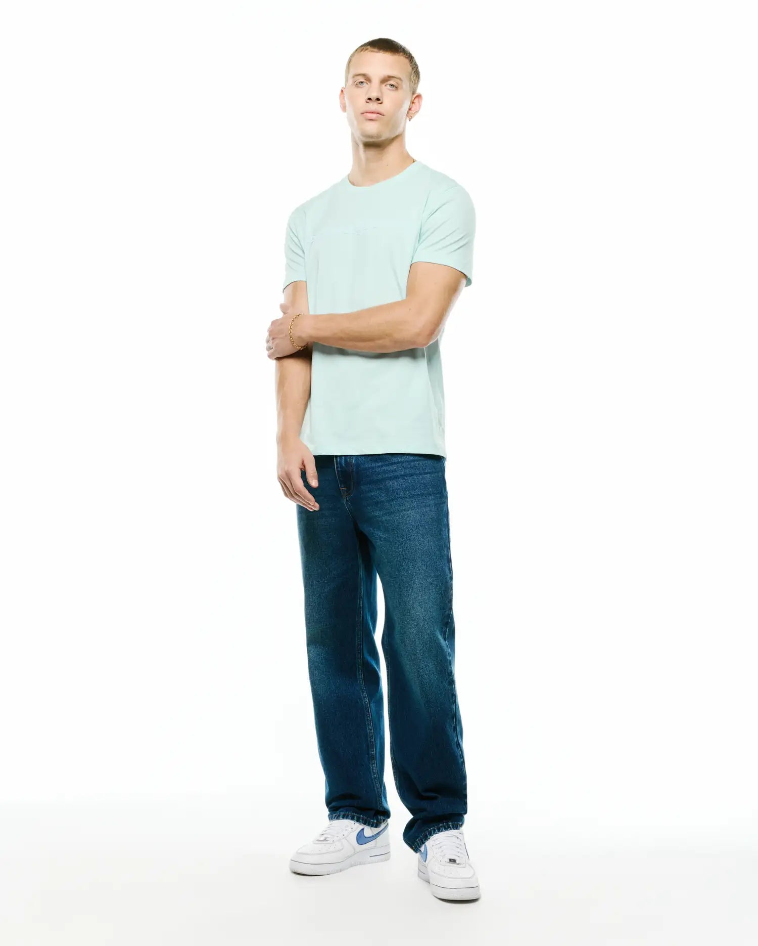 Men's Royce Graphic Tee, a classic fit light aqua jersey t-shirt featuring a subtle tonal Psycho Bunny graphic print on the chest. (5)