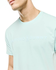 Men's Royce Graphic Tee, a light aqua classic fit jersey t-shirt with a large, tonal embossed Psycho Bunny text logo and iconic bunny skull on the chest. (3)