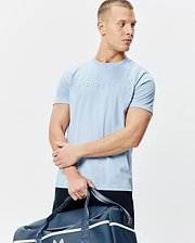 Mens Royce Graphic Tee, sky blue classic fit jersey knit t-shirt featuring a large, raised Psycho Bunny bunny skull logo and text centered on the chest.
