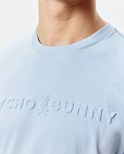Mens Royce Graphic Tee, a light blue classic fit jersey t-shirt featuring a large, embossed, tone-on-tone Psycho Bunny logo with skull graphic on the chest.