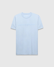 Mens Royce Graphic Tee in light blue, featuring a classic fit and smooth jersey knit fabric. A large, embossed Psycho Bunny text logo with the iconic skull graphic is centered on the chest.