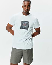 White Mens Langston Graphic Tee, classic fit, soft jersey knit, featuring a large center chest graphic of the multicolor Psycho Bunny skull logo within a striped square.
