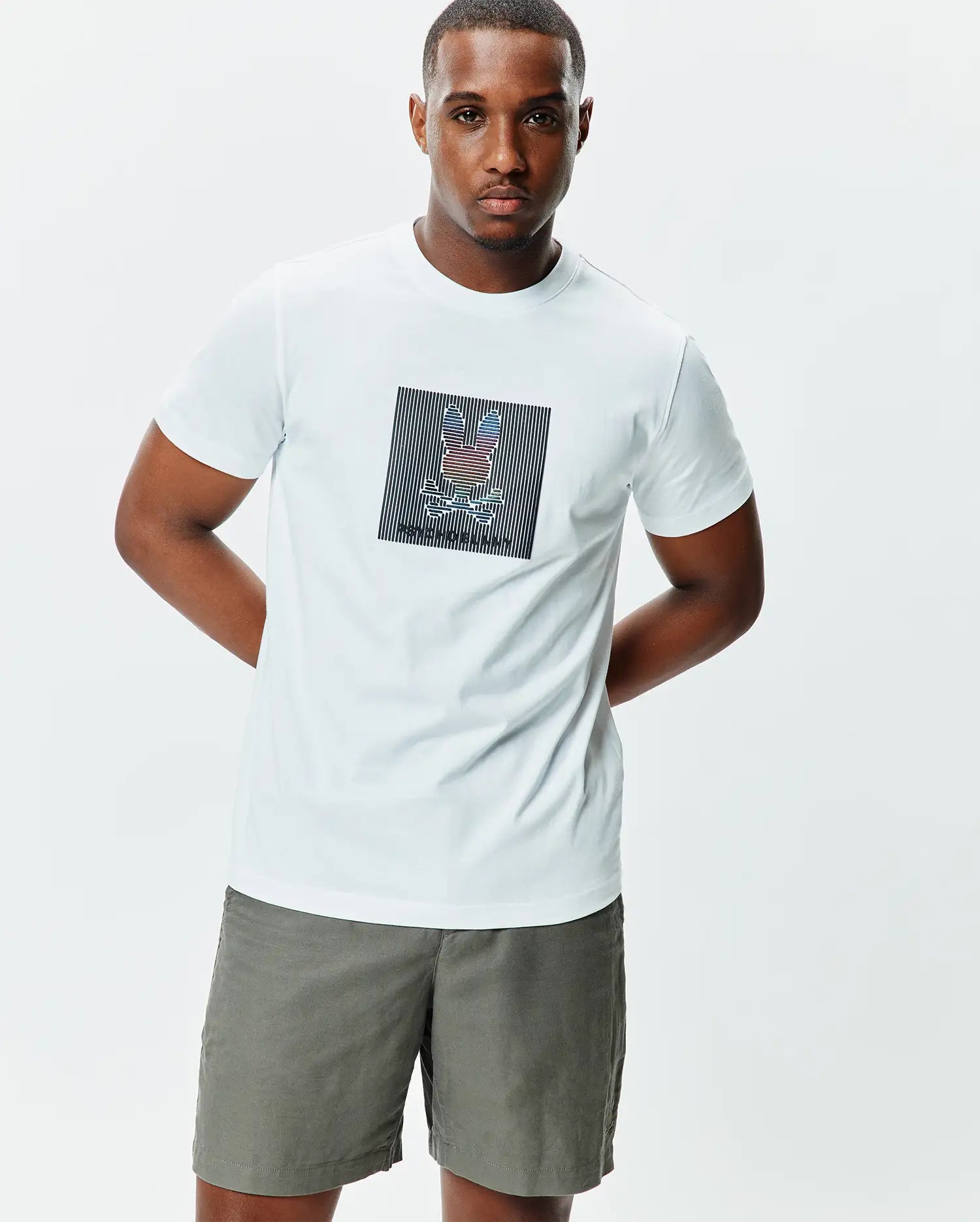White Mens Langston Graphic Tee, classic fit, soft jersey knit, featuring a large center chest graphic of the multicolor Psycho Bunny skull logo within a striped square.