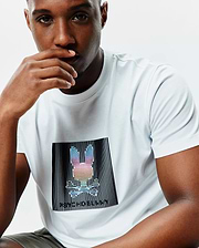 White Mens Langston Graphic Tee in classic fit jersey knit, featuring a large central chest graphic of a rainbow Psycho Bunny skull logo within black vertical lines and Psycho Bunny text.