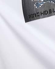 Mens Langston Graphic Tee, a white jersey knit t-shirt with a bold, textured black and blue graphic print featuring raised PSYCHO BUNNY lettering on the chest.