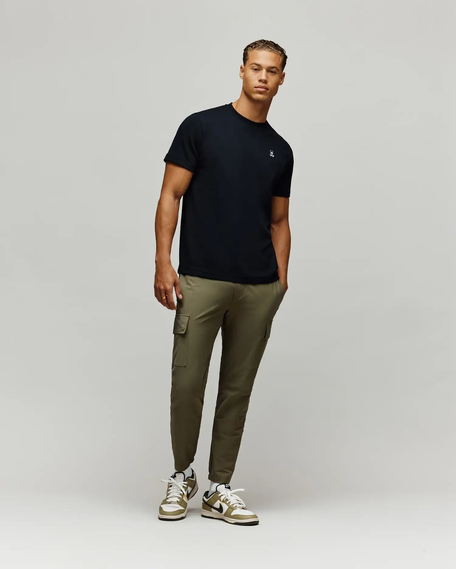 Black Mens Maxton Waffle Tee, a premium classic fit garment, showcasing the iconic small embroidered white and light blue Psycho Bunny skull logo on the left chest.