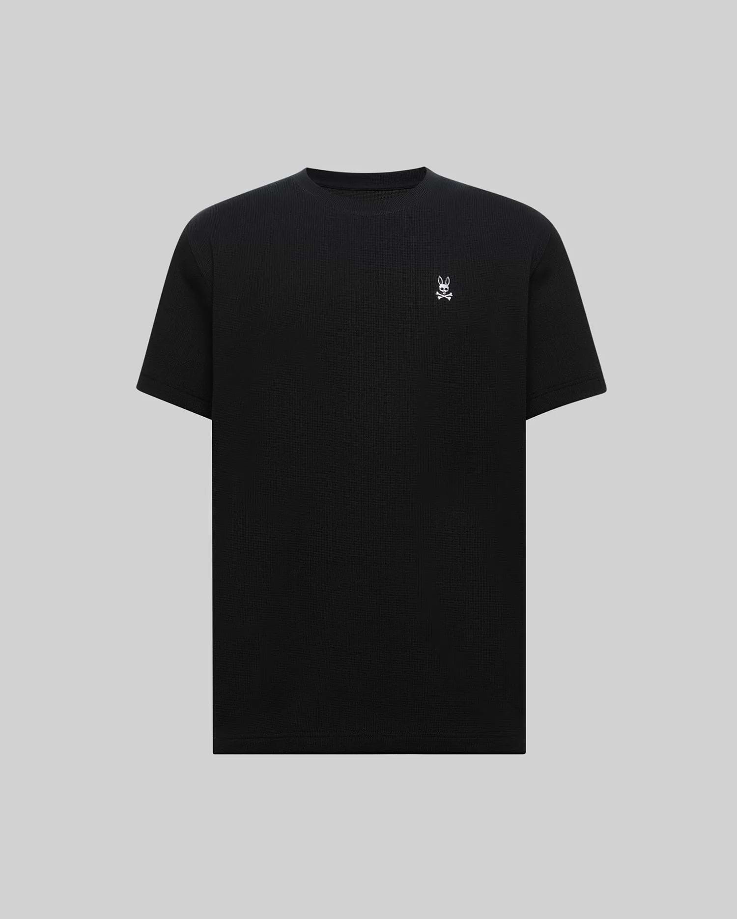 Mens Maxton Waffle Tee, a premium classic fit black waffle knit t-shirt featuring a small, crisp white embroidered Psycho Bunny skull logo on the left chest.