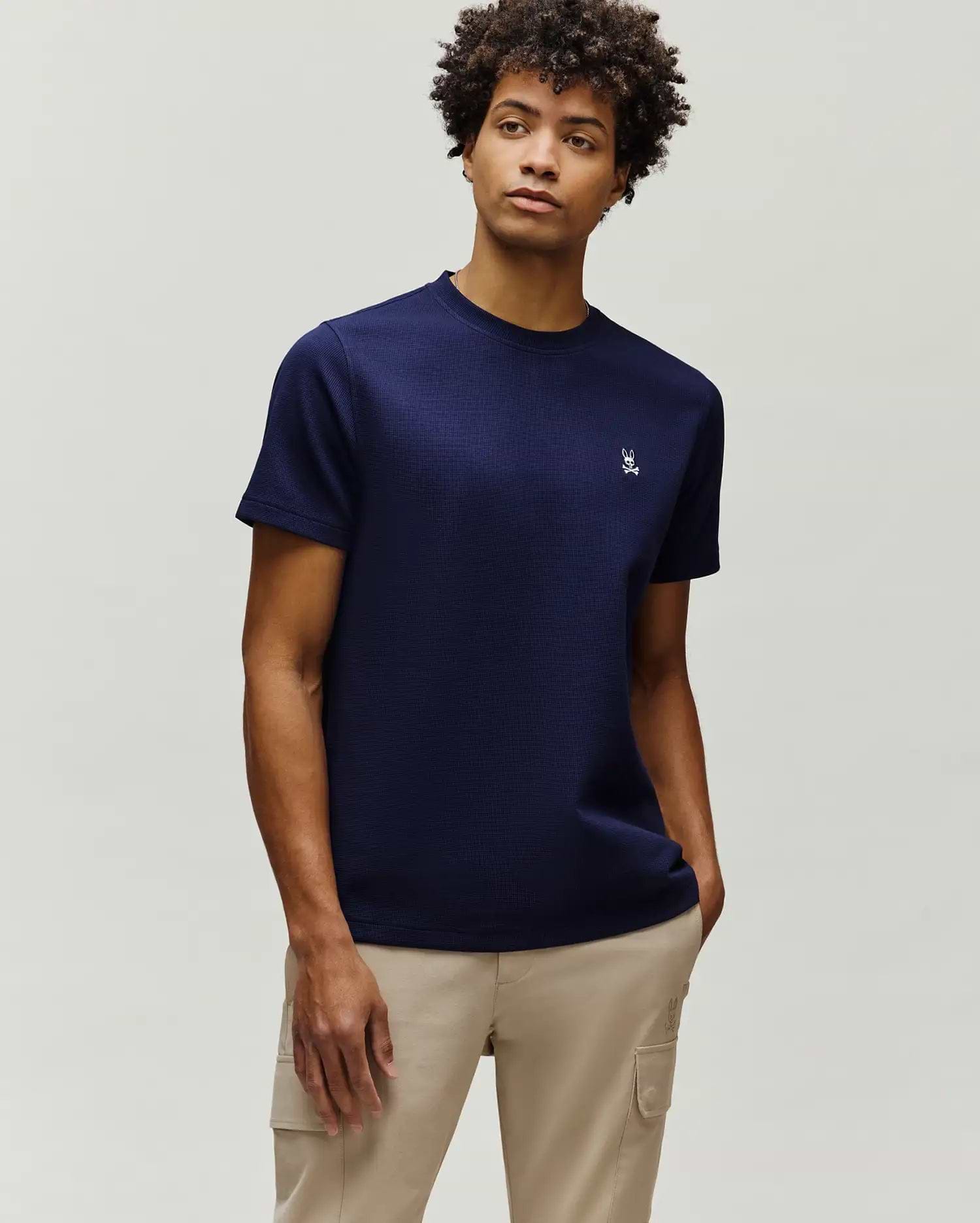 Mens Maxton Waffle Tee in navy, featuring a classic fit and textured waffle knit fabric. A small, white embroidered Psycho Bunny skull logo is on the left chest.