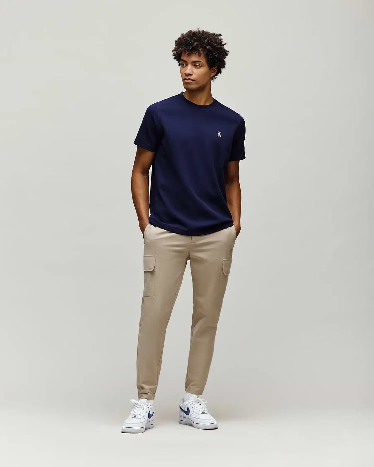 Navy blue Mens Maxton Waffle Tee with a classic fit and subtle waffle knit texture, featuring a small embroidered white Psycho Bunny skull logo on the left chest.