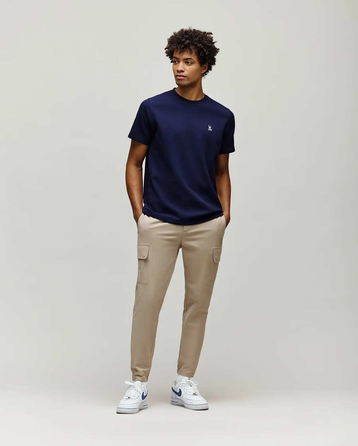 Navy blue Mens Maxton Waffle Tee with a classic fit and subtle waffle knit texture, featuring a small embroidered white Psycho Bunny skull logo on the left chest.