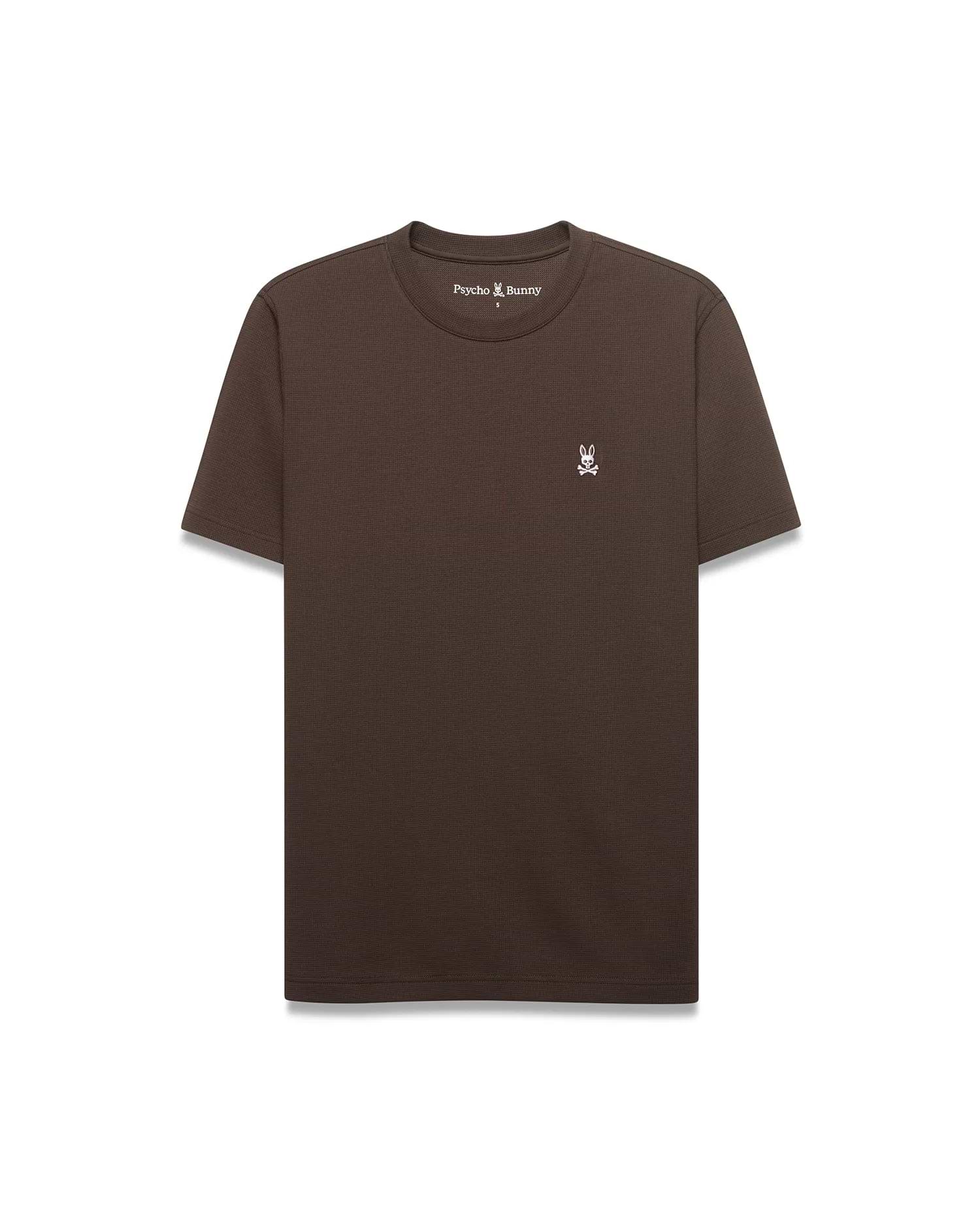 Men's Maxton Waffle Tee, a classic fit dark brown waffle knit t-shirt with a small embroidered white Psycho Bunny skull logo, featuring a pink eye, on the left chest. (4)
