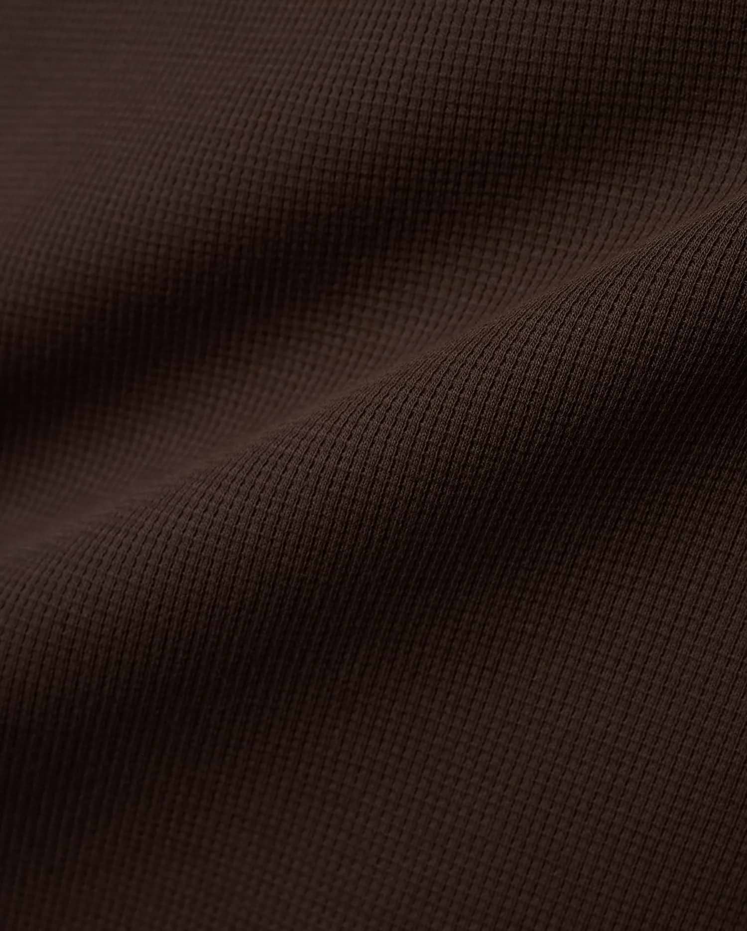 Men's Maxton Waffle Tee in a deep, luxurious dark brown, featuring a prominent and textured waffle knit fabric with subtle folds, highlighting its premium quality. (5)