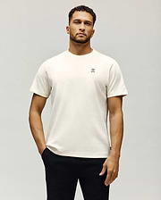 Mens Maxton Waffle Tee in cream, featuring a classic fit and waffle knit texture. Small embroidered Psycho Bunny skull logo with white and blue accents on the left chest.