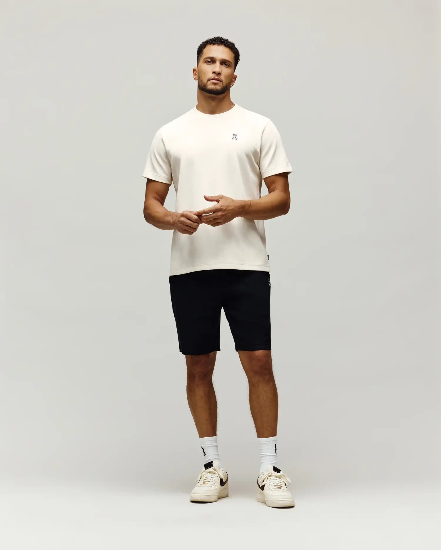 Cream Mens Maxton Waffle Tee, a classic fit t-shirt with a visible waffle knit texture and a small, embroidered black Psycho Bunny skull logo on the left chest.