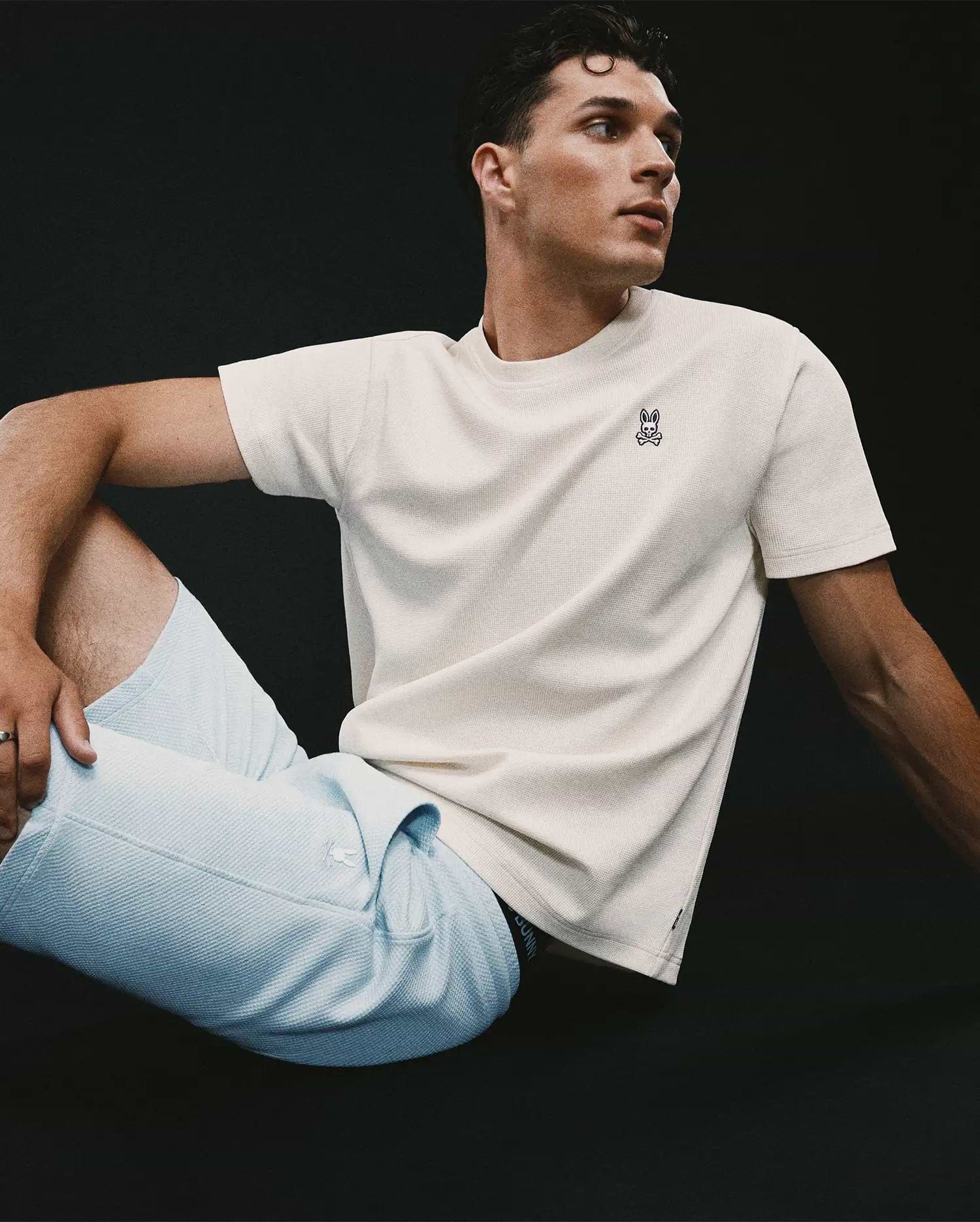 Mens Maxton Waffle Tee in cream, featuring a classic fit and textured waffle knit fabric, with a small embroidered black and white Psycho Bunny skull logo on the left chest.