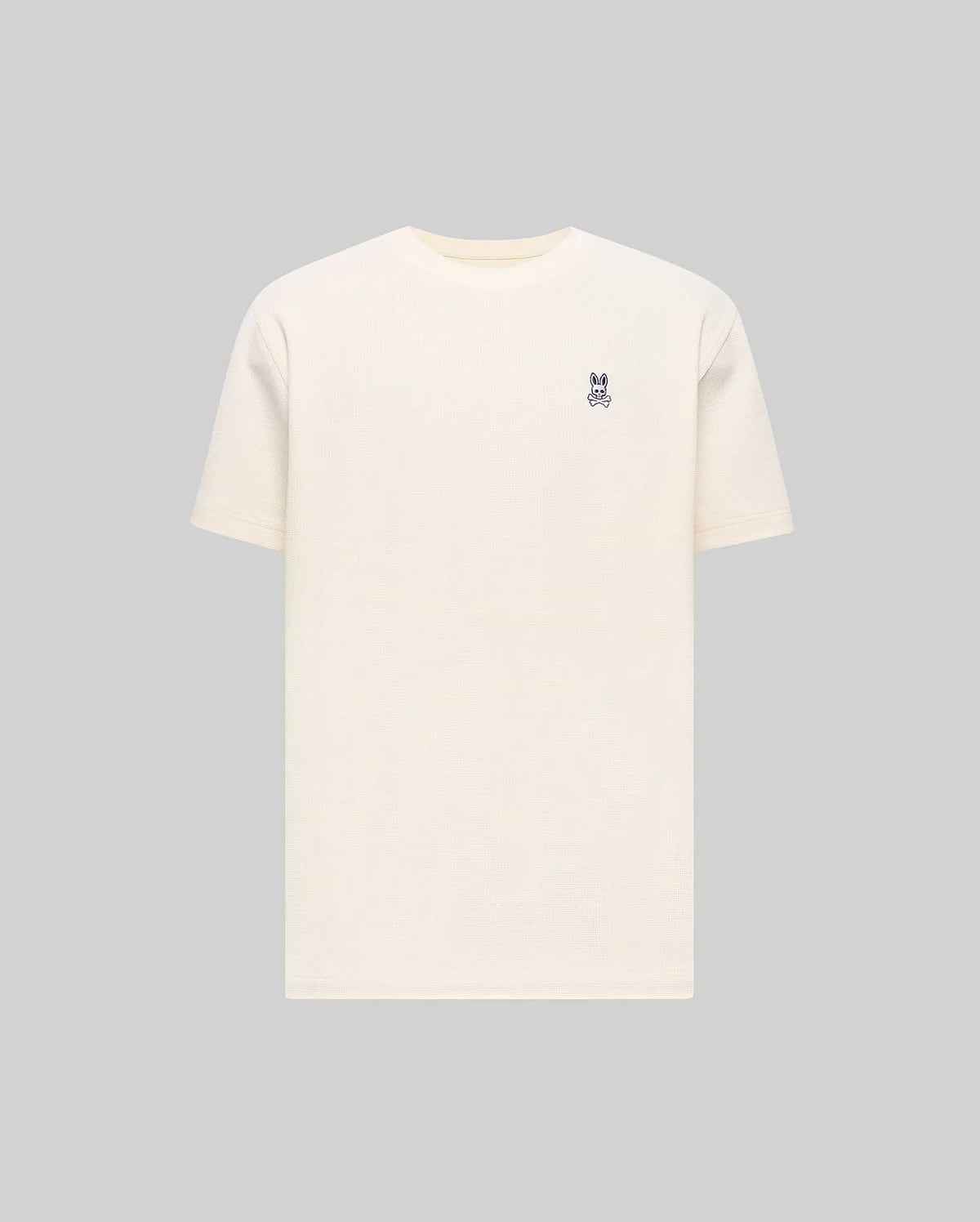 Mens Maxton Waffle Tee in cream, featuring a classic fit and textured waffle knit fabric, with a small embroidered dark blue Psycho Bunny skull logo on the left chest.