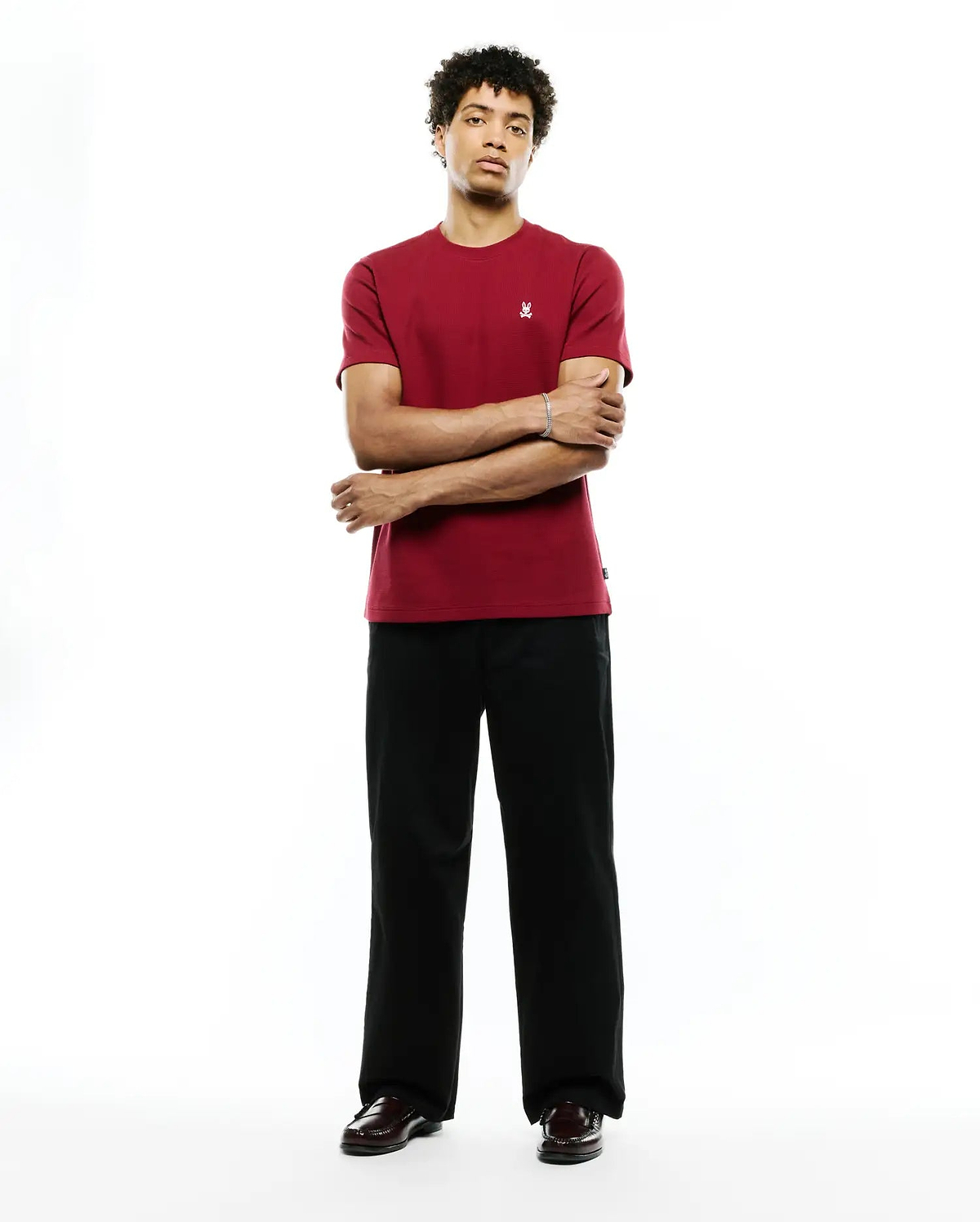 Mens Maxton Waffle Tee, a classic fit deep red t-shirt with a visible waffle knit texture and a small, embroidered white Psycho Bunny skull logo on the left chest.