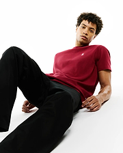 Mens Maxton Waffle Tee in rich burgundy, showcasing a classic fit and prominent waffle knit texture. Features a small, white embroidered Psycho Bunny skull logo on the left chest.