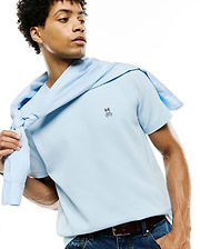 Mens Maxton Waffle Tee in light blue, featuring a classic fit and textured waffle knit fabric, with a small embroidered Psycho Bunny skull logo on the left chest.