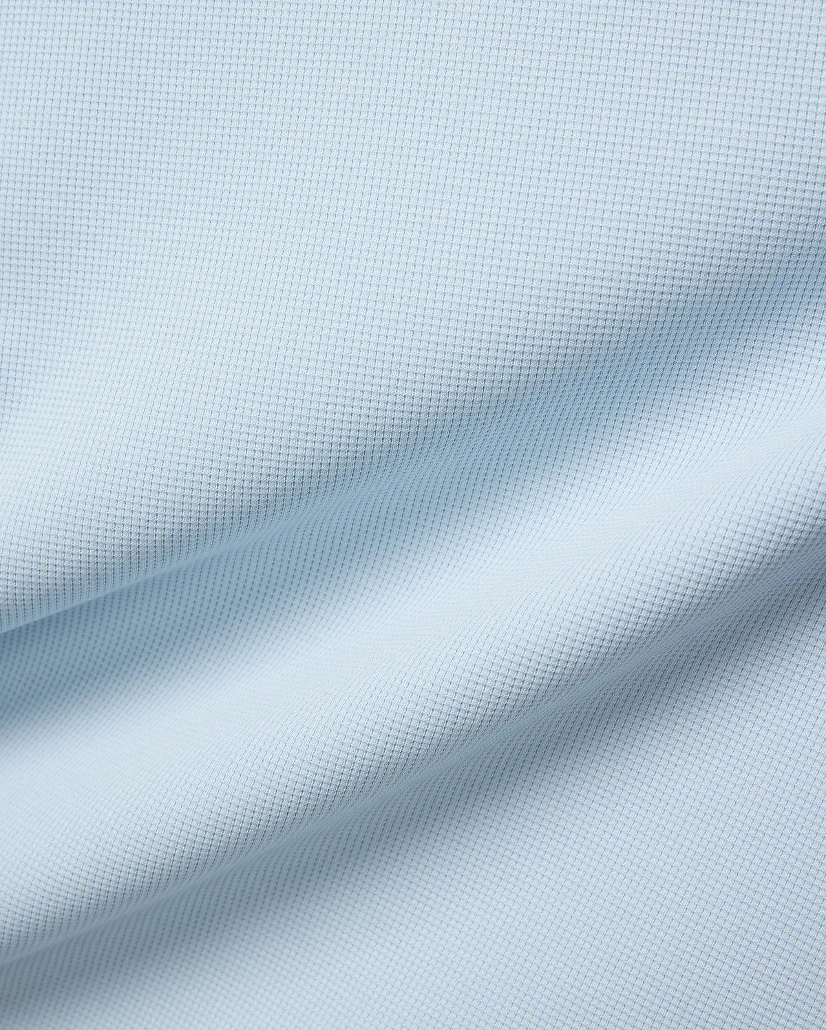 Mens Maxton Waffle Tee in soft light blue, crafted from a comfortable waffle knit fabric, featuring the iconic small embroidered Psycho Bunny skull logo on the left chest.