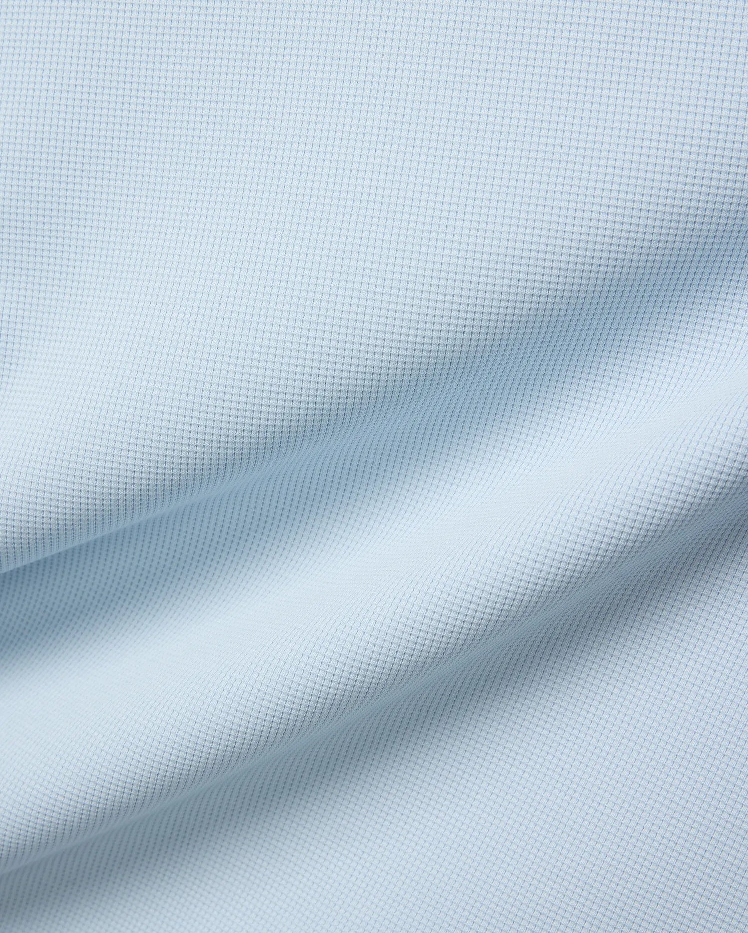Mens Maxton Waffle Tee in soft light blue, crafted from a comfortable waffle knit fabric, featuring the iconic small embroidered Psycho Bunny skull logo on the left chest.
